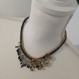 Elegant Gold and Black Necklace with Floral Accents